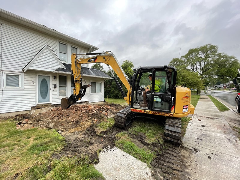 small-excavator-near-house-64632635400__18B3ED0F-0562-4495-A49D-64DD011F9A1C.fullsizerender-min.jpg